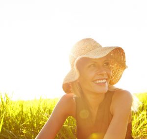 Woman in a sun hat in a field
