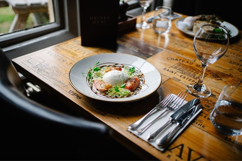 Barrata Salad on a dining table in the corner house hotel