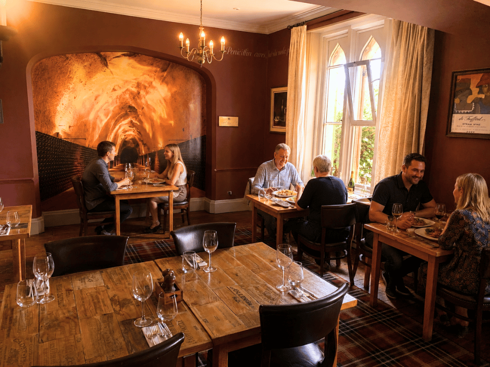 couples enjoying the sun dappled dining experience at the corner house hotel restaurant